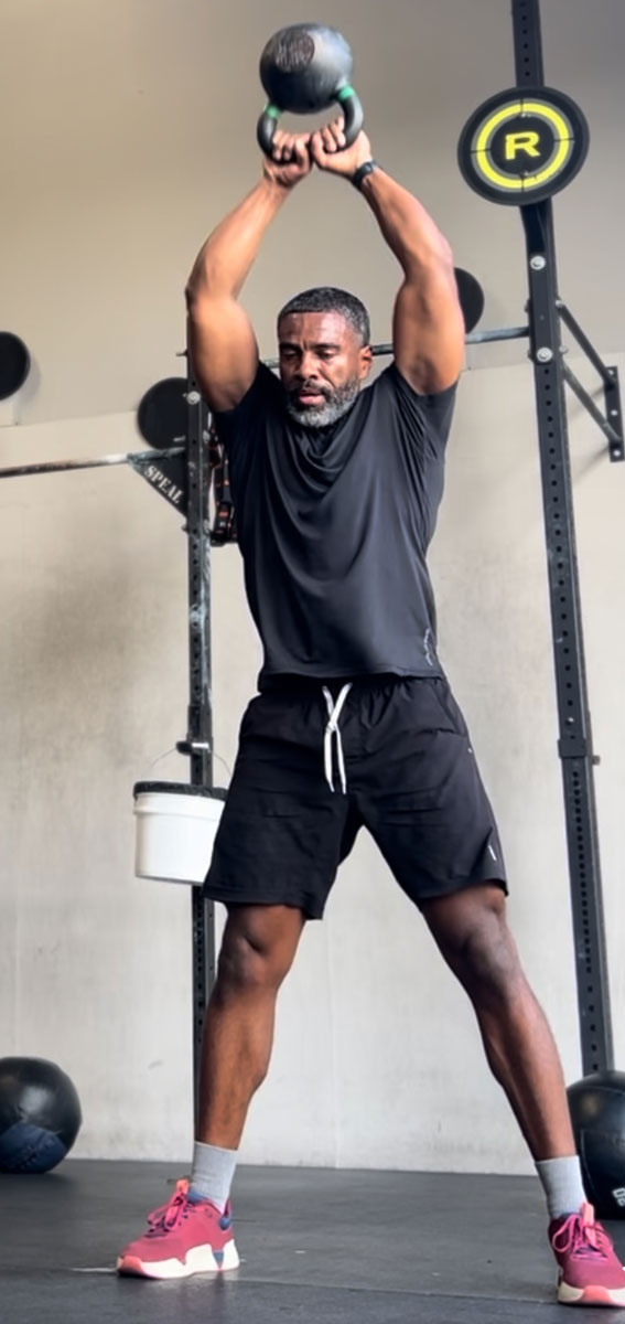 The coach is working out at the gym.